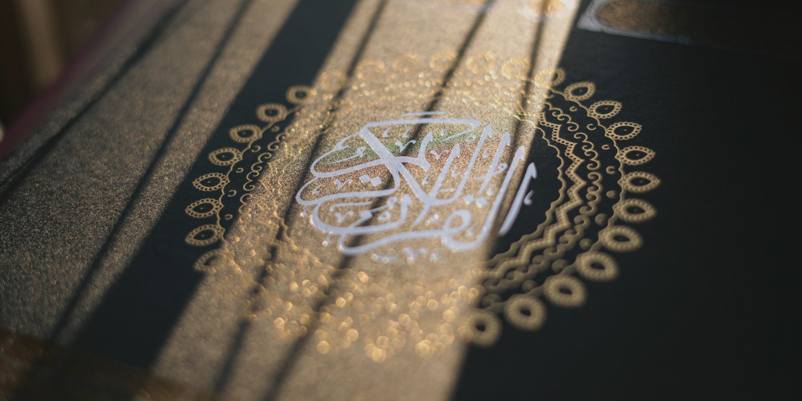 vecteezy_quran-or-kuran-the-islamic-holy-book-on-sun-shine-black_21219569